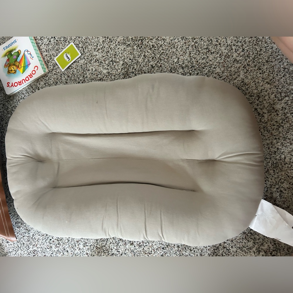 Snuggle Me Organic sleeper. Brownish tan.